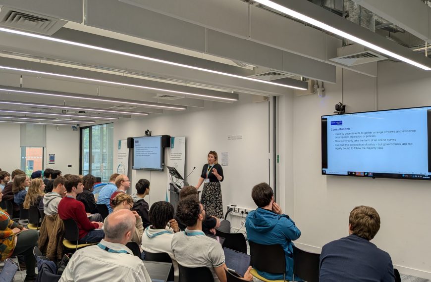A crowd of event attendees watching a speaker at the UK Metamaterials Summer School 2025